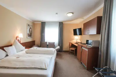 Ein Bett oder Betten in einem Zimmer der Unterkunft Park Residence