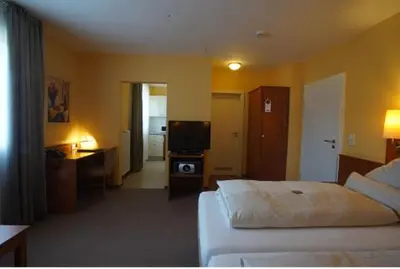 Ein Bett oder Betten in einem Zimmer der Unterkunft Park Residence