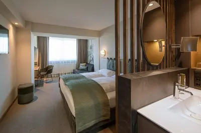 Ein Bett oder Betten in einem Zimmer der Unterkunft Parkhotel Schmid