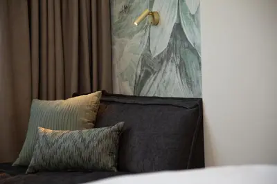 Ein Bett oder Betten in einem Zimmer der Unterkunft Parkhotel Schmid