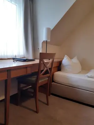 Ein Bett oder Betten in einem Zimmer der Unterkunft Parkhotel Schmid