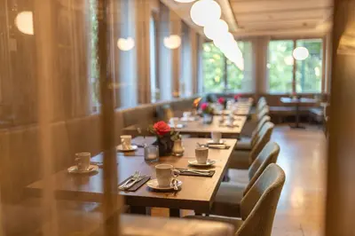 Ein Restaurant oder anderes Speiselokal in der Unterkunft Parkhotel Schmid