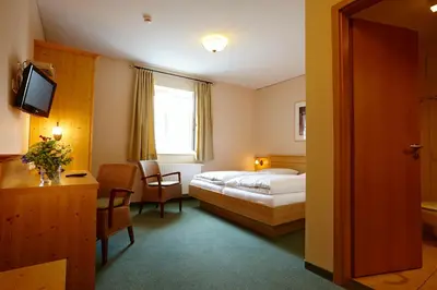 Ein Bett oder Betten in einem Zimmer der Unterkunft Hotel Eberl
