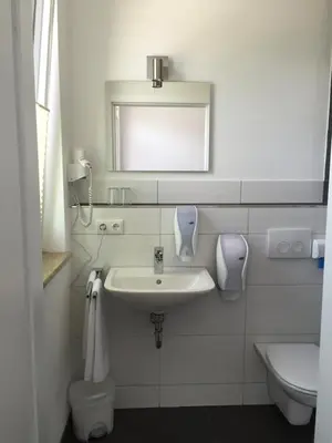 Ein Badezimmer in der Unterkunft Hotel 37