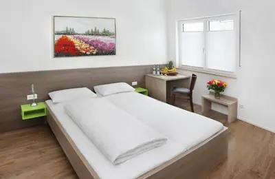 Ein Bett oder Betten in einem Zimmer der Unterkunft Hotel 37