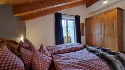 Ein Bett oder Betten in einem Zimmer der Unterkunft Gästehaus Alpenparadies