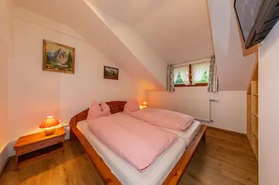 Ein Bett oder Betten in einem Zimmer der Unterkunft Gröbl-Alm Haus zur schönen Aussicht