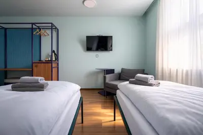 Ein Bett oder Betten in einem Zimmer der Unterkunft Das Schreder Hotel - Munich Free Parking