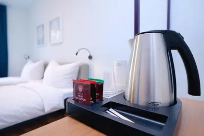 Ein Bett oder Betten in einem Zimmer der Unterkunft Das Schreder Hotel - Munich Free Parking