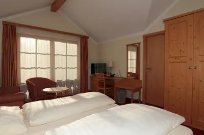 Ein Bett oder Betten in einem Zimmer der Unterkunft Landgasthof Drei Rosen