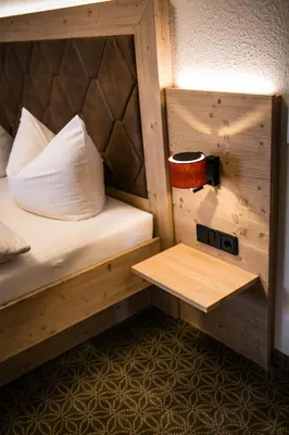 Ein Bett oder Betten in einem Zimmer der Unterkunft Hohenester Gasthaus & Hotel