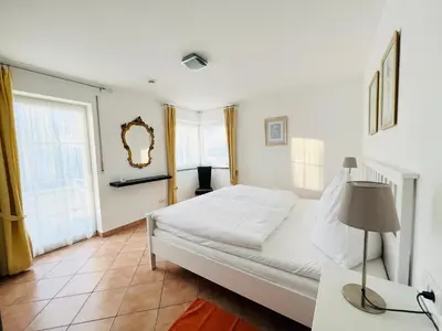 Ein Bett oder Betten in einem Zimmer der Unterkunft Ferienwohnungen Birkenhof