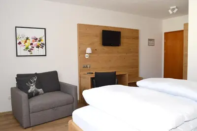 Ein Bett oder Betten in einem Zimmer der Unterkunft Gasthof Ramsauer