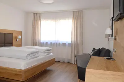 Ein Bett oder Betten in einem Zimmer der Unterkunft Gasthof Ramsauer