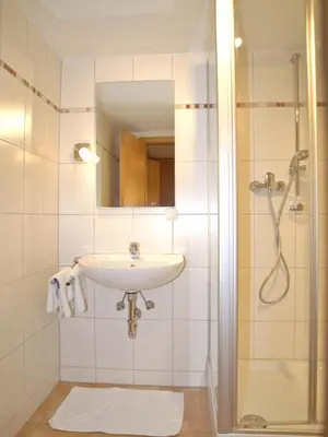 Ein Badezimmer in der Unterkunft Gasthof Ramsauer