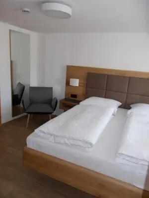 Ein Bett oder Betten in einem Zimmer der Unterkunft Gasthof Ramsauer