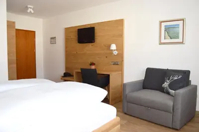 Ein Bett oder Betten in einem Zimmer der Unterkunft Gasthof Ramsauer