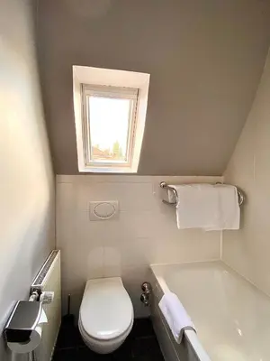 Ein Badezimmer in der Unterkunft Das Nikolai Hotel
