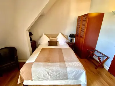Ein Bett oder Betten in einem Zimmer der Unterkunft Das Nikolai Hotel