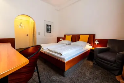 Ein Bett oder Betten in einem Zimmer der Unterkunft Hotel Carlton Munich