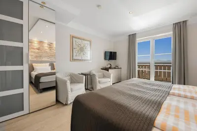 Ein Bett oder Betten in einem Zimmer der Unterkunft ChiemseeStern Vacation & Recreation 