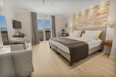 Ein Bett oder Betten in einem Zimmer der Unterkunft ChiemseeStern Vacation & Recreation 