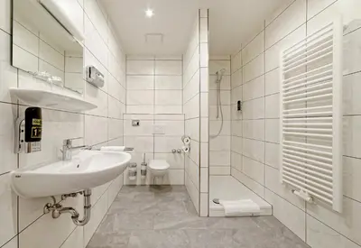 Ein Badezimmer in der Unterkunft Hotel Bayerisch Meran