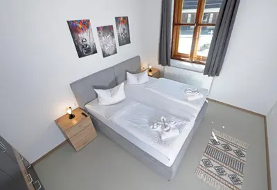 Ein Bett oder Betten in einem Zimmer der Unterkunft Hotel Bayerisch Meran