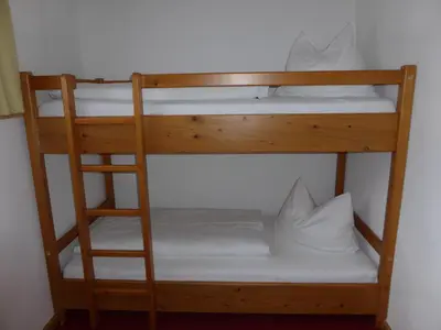 Ein Bett oder Betten in einem Zimmer der Unterkunft Gasthaus - Pension - Café Dörfl