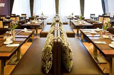 Ein Restaurant oder anderes Speiselokal in der Unterkunft Parkhotel Heidehof Apartements