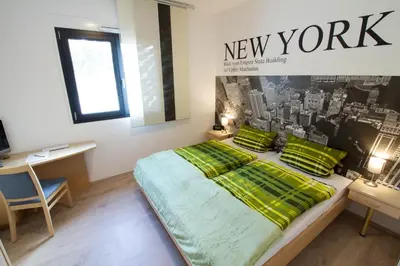 Ein Bett oder Betten in einem Zimmer der Unterkunft Boardinghouse-Ebenhausen