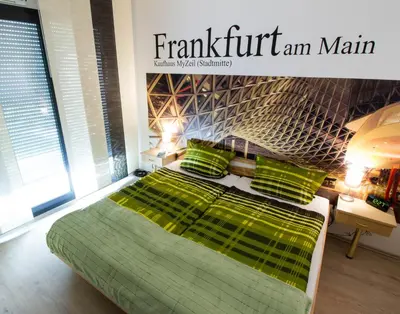 Ein Bett oder Betten in einem Zimmer der Unterkunft Boardinghouse-Ebenhausen