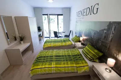 Ein Bett oder Betten in einem Zimmer der Unterkunft Boardinghouse-Ebenhausen