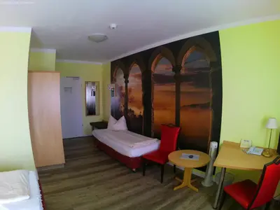 Ein Bett oder Betten in einem Zimmer der Unterkunft Hotel Thannhof