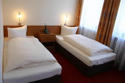 Ein Bett oder Betten in einem Zimmer der Unterkunft Hotel Accolo