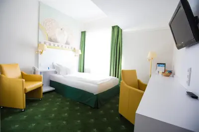 Ein Bett oder Betten in einem Zimmer der Unterkunft Hotel König Ludwig II