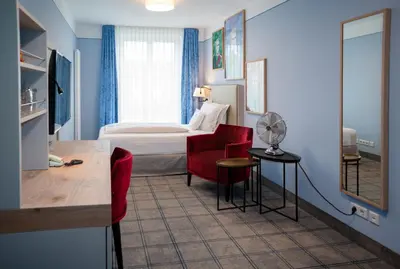Ein Bett oder Betten in einem Zimmer der Unterkunft Hotel König Ludwig II