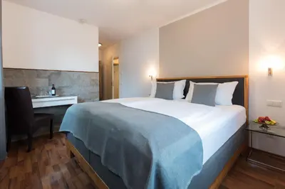 Ein Bett oder Betten in einem Zimmer der Unterkunft Hotel Villa Rosa