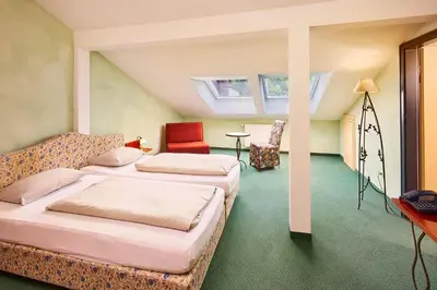 Ein Bett oder Betten in einem Zimmer der Unterkunft Landhotel Kistlerwirt
