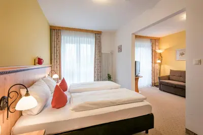 Ein Bett oder Betten in einem Zimmer der Unterkunft Berghaus - Der Westerhof Hotel