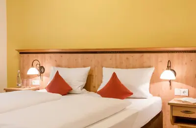 Ein Bett oder Betten in einem Zimmer der Unterkunft Berghaus - Der Westerhof Hotel