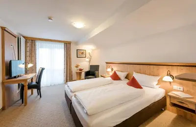 Ein Bett oder Betten in einem Zimmer der Unterkunft Berghaus - Der Westerhof Hotel