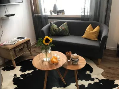 Ein Sitzbereich in der Unterkunft Gästehaus zur Linde