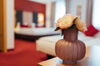 Ein Bett oder Betten in einem Zimmer der Unterkunft Hotel Andra München