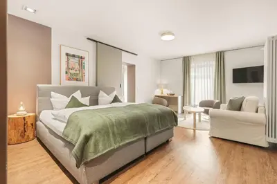 Ein Bett oder Betten in einem Zimmer der Unterkunft Hotel Villa Lago