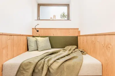 Ein Bett oder Betten in einem Zimmer der Unterkunft Hotel Villa Lago