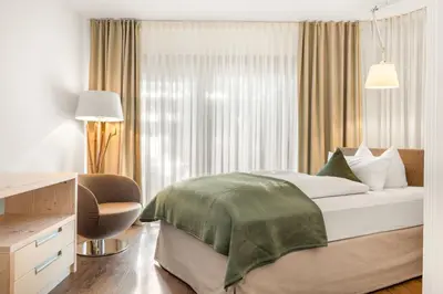 Ein Bett oder Betten in einem Zimmer der Unterkunft Hotel Villa Lago