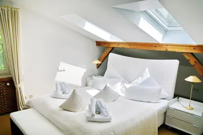 Ein Bett oder Betten in einem Zimmer der Unterkunft Chiemsee Landhaus