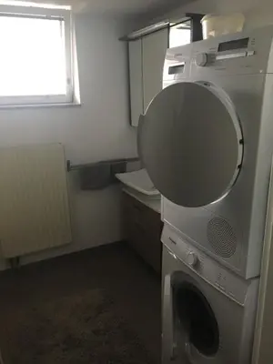 Küche/Küchenzeile in der Unterkunft L&L Lodge Günding