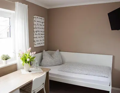 Ein Bett oder Betten in einem Zimmer der Unterkunft Pension M